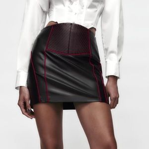 Faux leather skirt mini skirt with pink piping